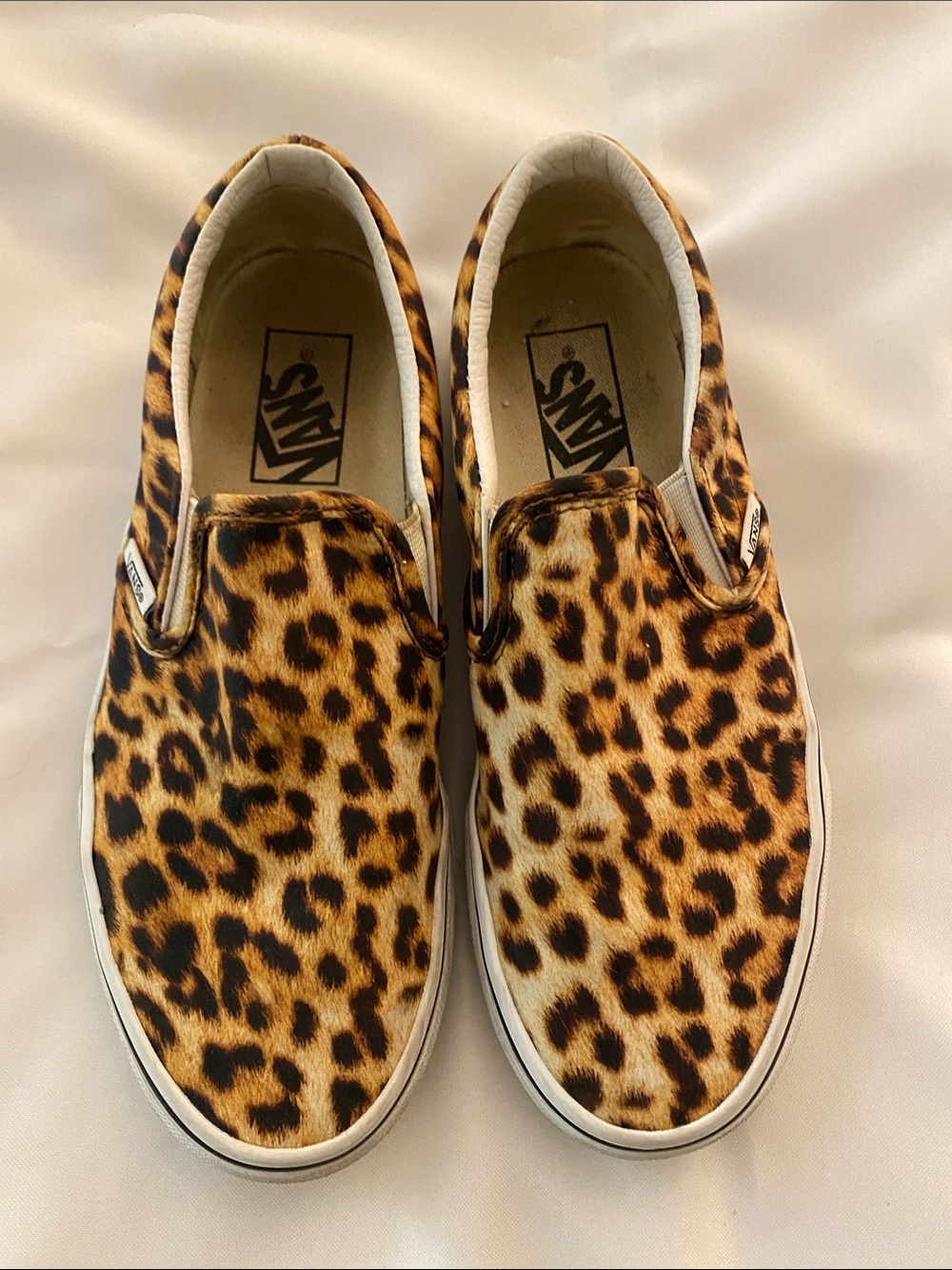 Vans Leopard Print Slip-On Sneakers in Brown and Black